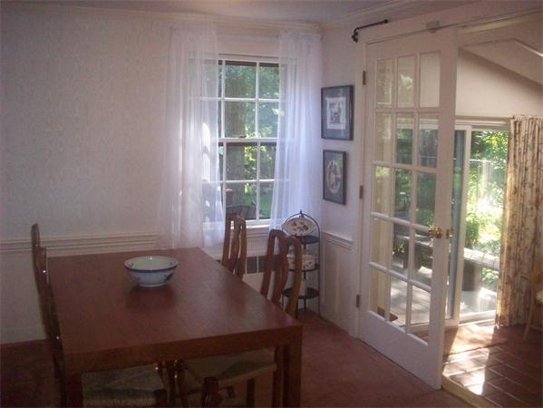 62 Oak Ridge Road Reading, MA 01867 - Photo 18 of 28 a view of a dining room with furniture window and outside view