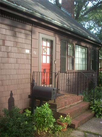 62 Oak Ridge Road Reading, MA 01867 - Photo 2 of 28 a view of a house with a small yard and wooden floor and fence