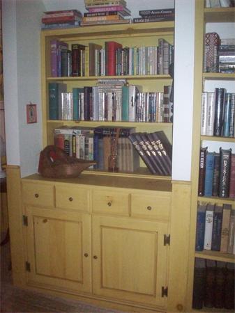 62 Oak Ridge Road Reading, MA 01867 - Photo 27 of 28 a view of books and closet