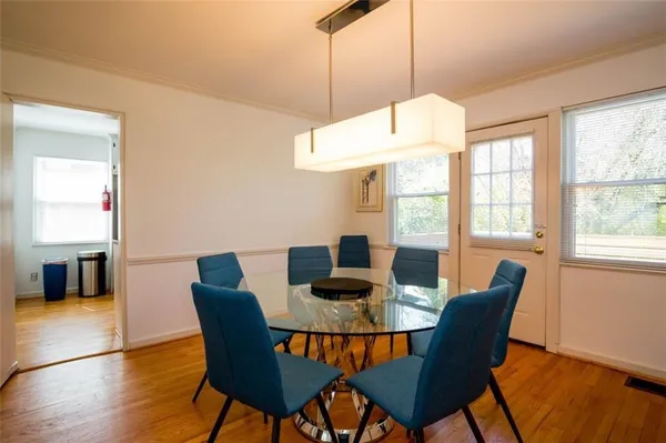 a dining room with furniture window wooden floor
