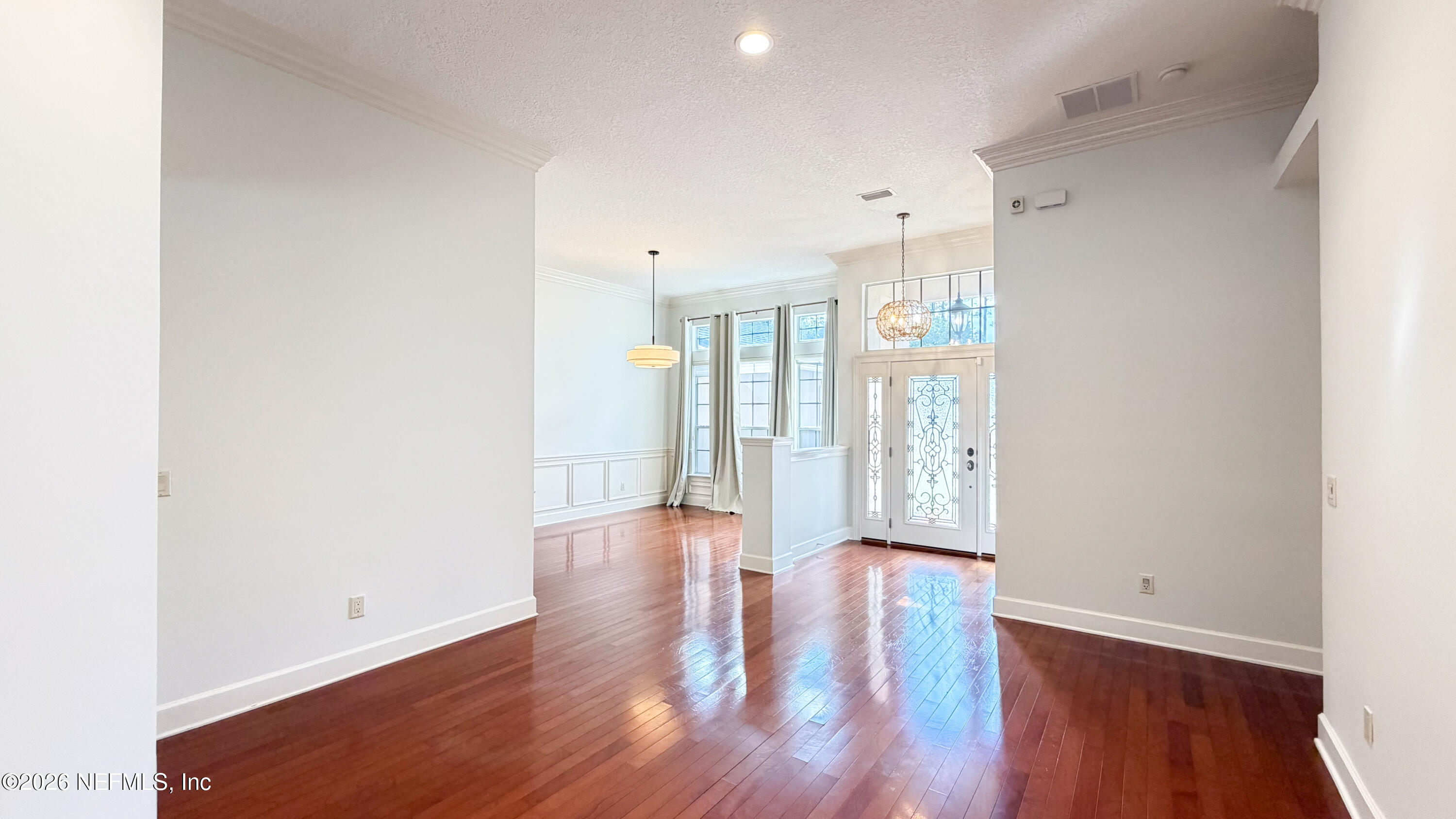 226 Towers Ranch Drive St. Augustine, FL 32092 - Photo 12 of 36 a view of an empty room with wooden floor and a window