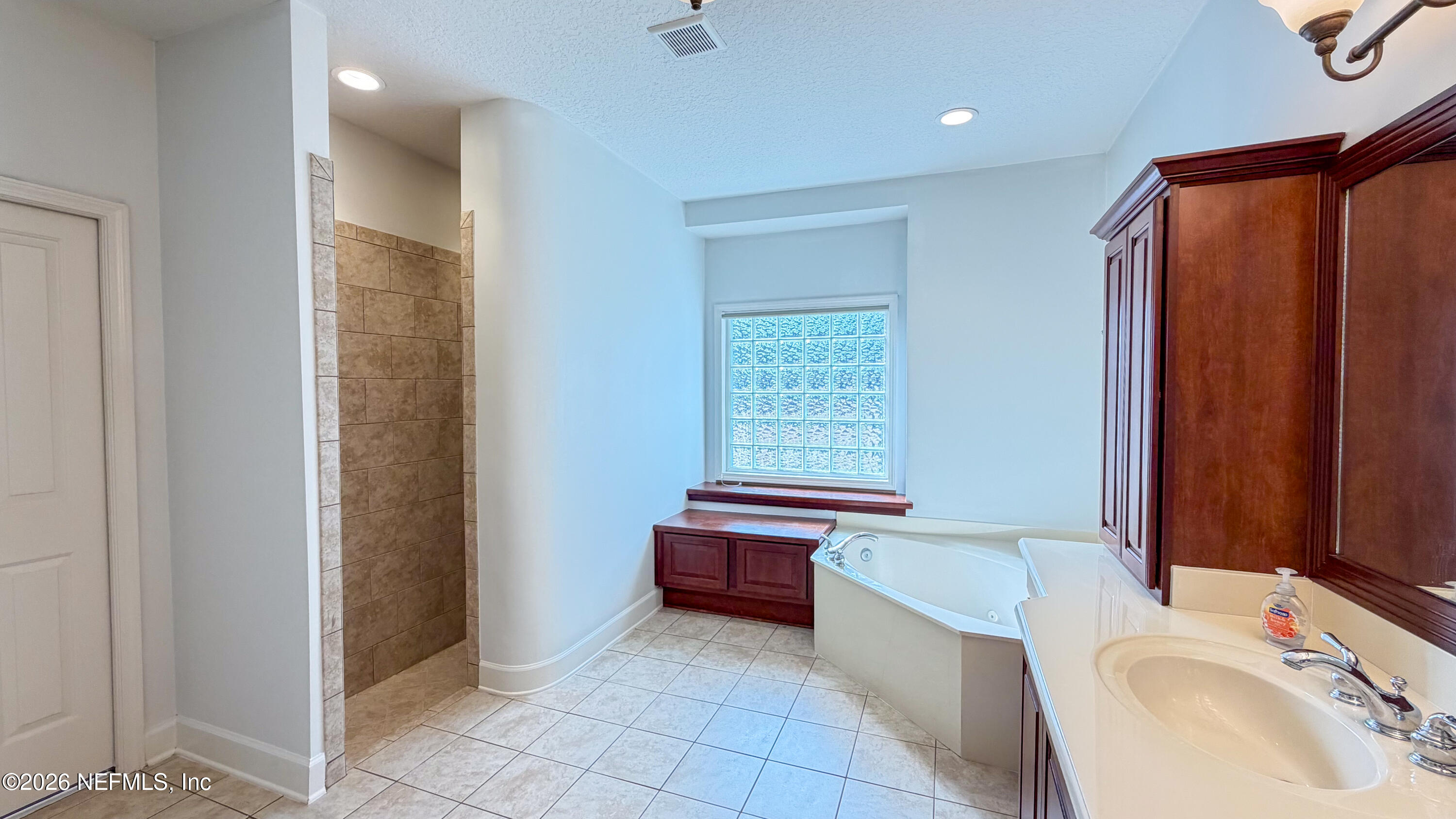 226 Towers Ranch Drive St. Augustine, FL 32092 - Photo 21 of 36 a bathroom with a sink a bathtub and a toilet