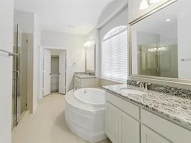 a bathroom with a bathtub and a sink