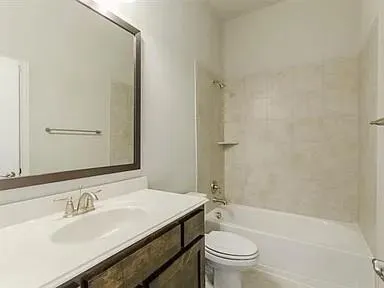 a bathroom with a sink a toilet and a bathtub
