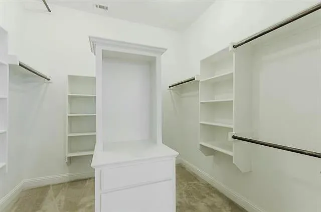 a view of an empty walk in closet