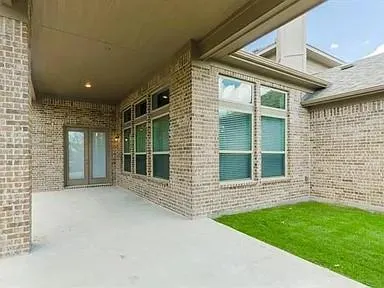 a view of front door of house and yard