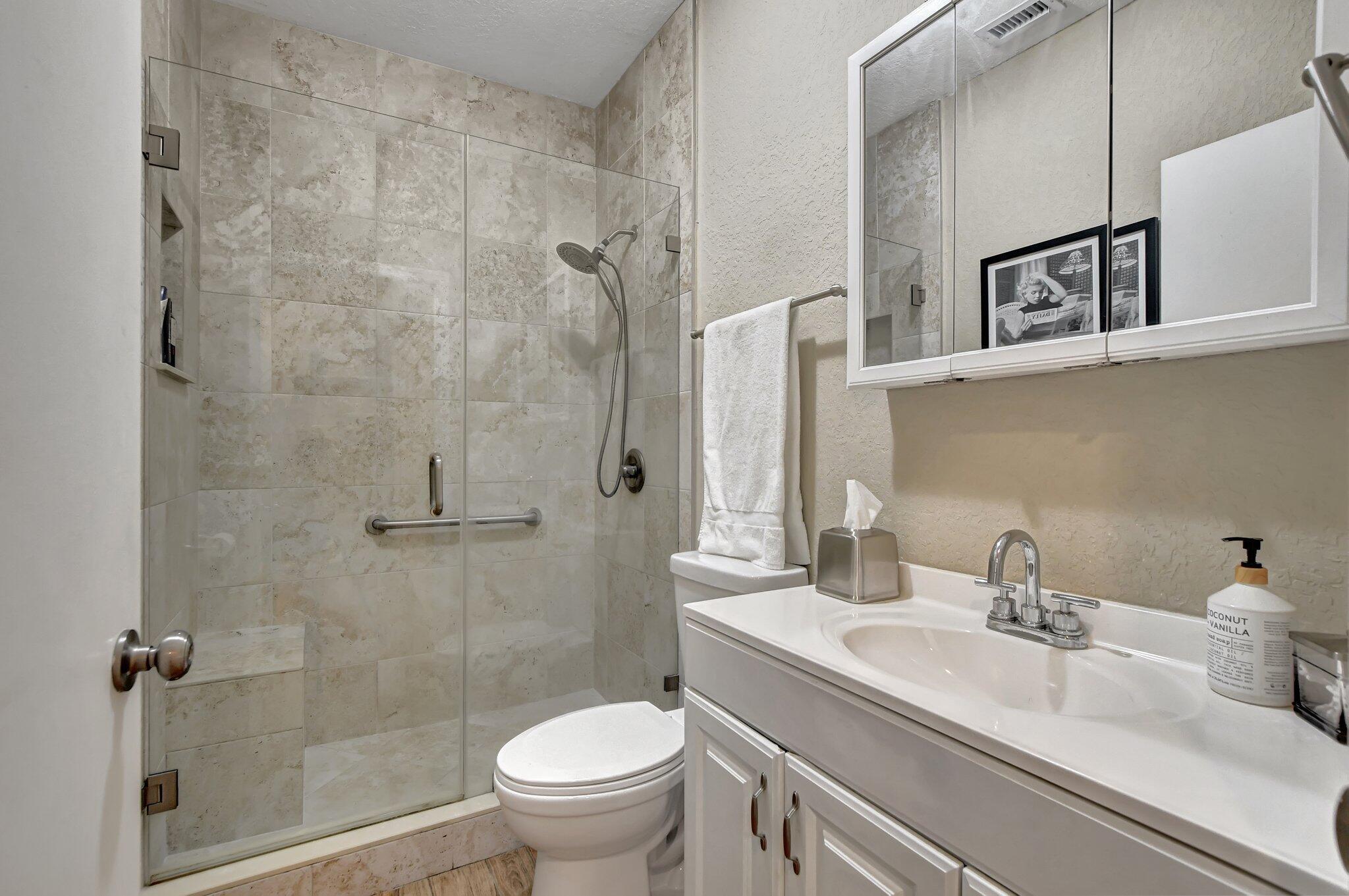 6682 Via Regina Boca Raton, FL 33433 - Photo 11 of 46 a bathroom with a sink toilet and shower