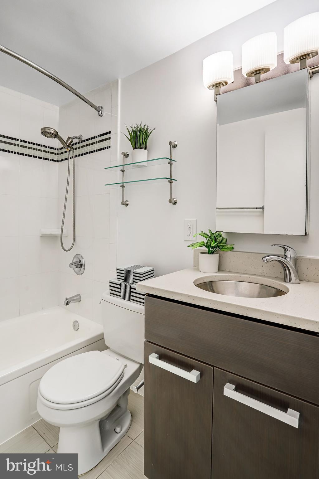 1101 3rd Street Southwest, Unit 206 Washington, DC 20024 - Photo 26 of 53 a bathroom with a sink a toilet and shower