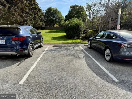 a view of a car parked in back of a house