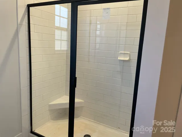a bathroom with a double vanity sink and mirror