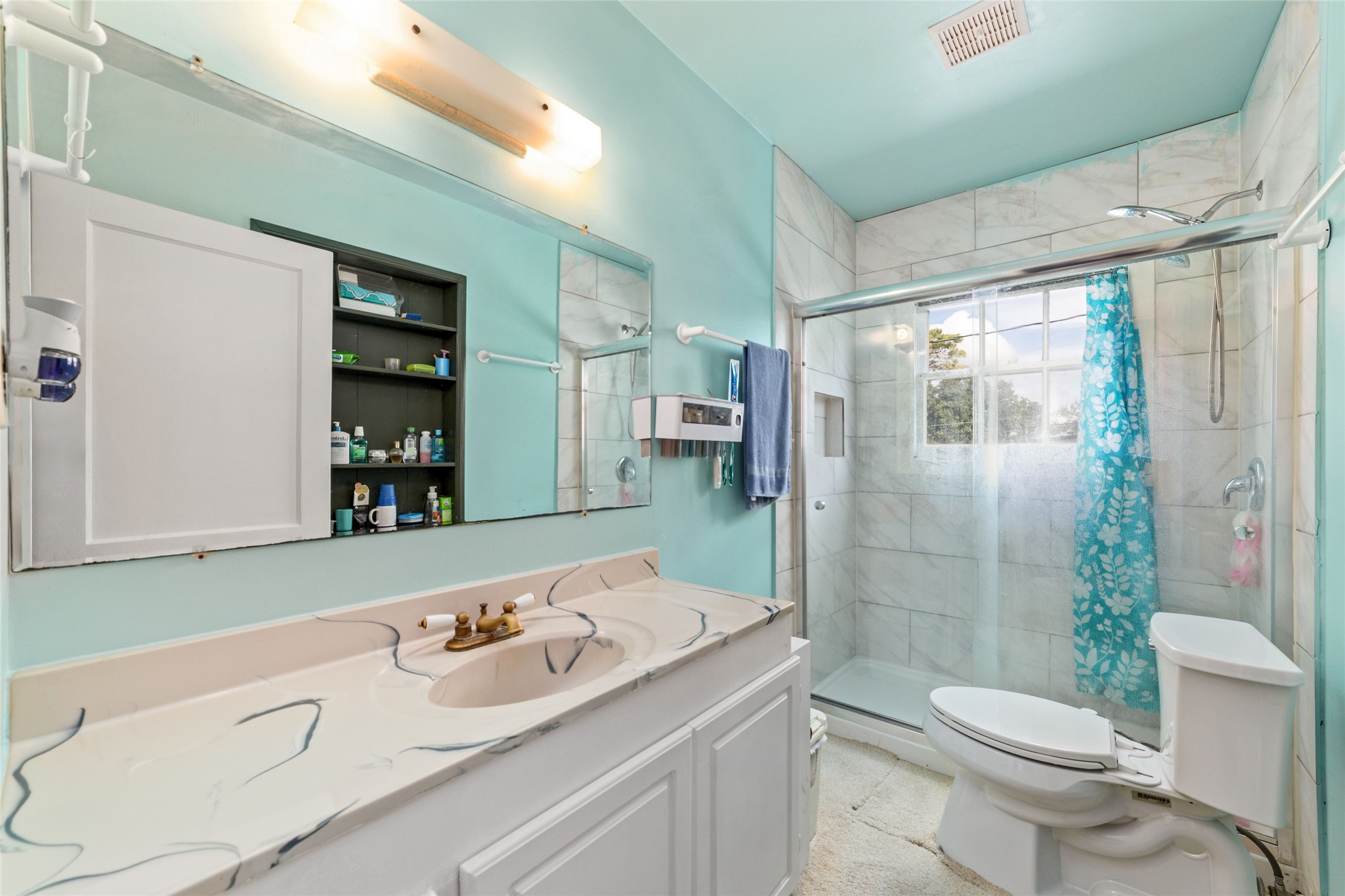 8023 Findlay Street Houston, TX 77017 - Photo 11 of 24 a bathroom with a sink toilet and shower