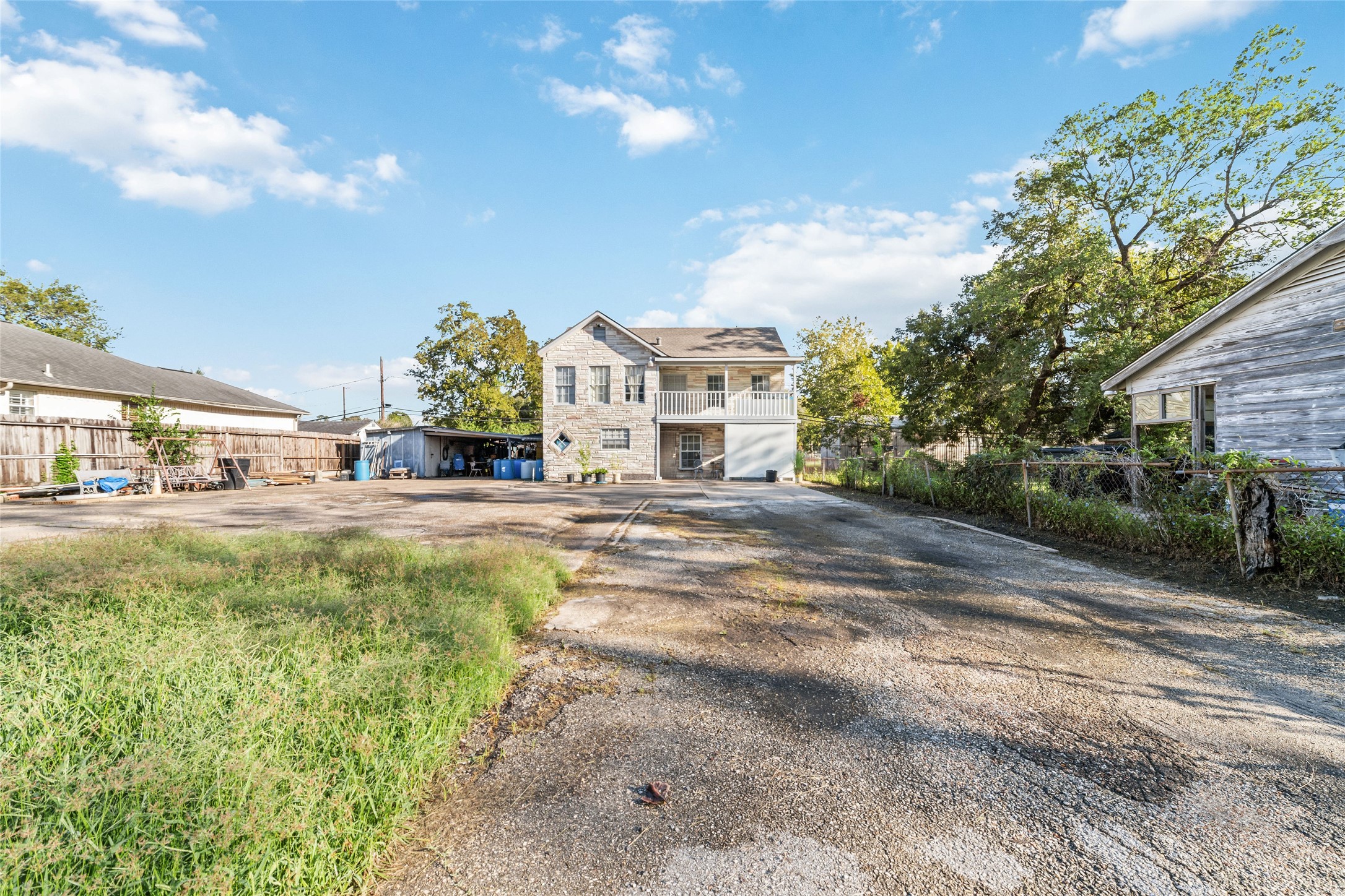 8023 Findlay Street Houston, TX 77017 - Photo 2 of 24 a view of a house with a big yard and large trees