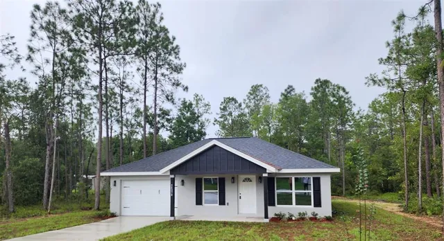 a house with trees in the background