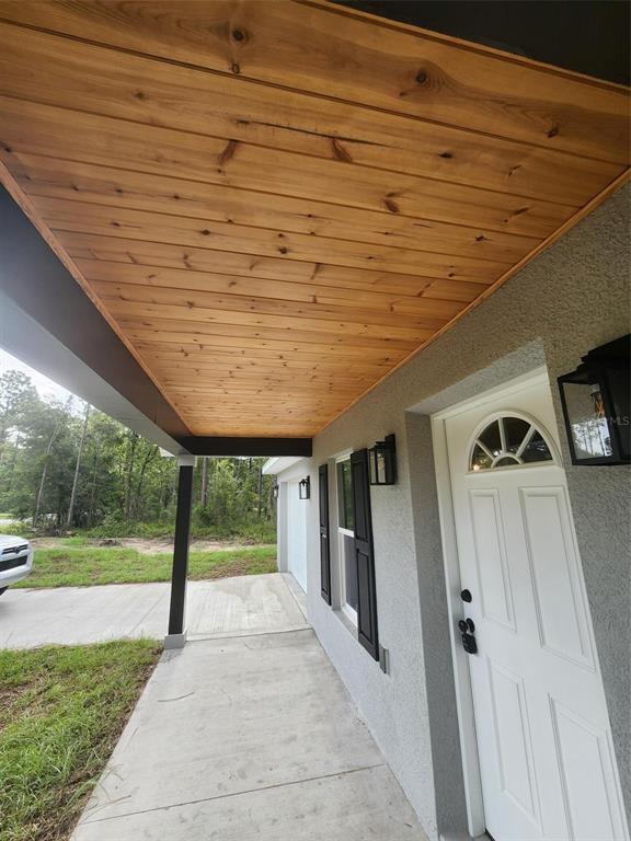 24370 Falcon Avenue Dunnellon, FL 34431 - Photo 23 of 24 a porch with seating space