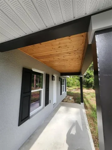 a kitchen with stainless steel appliances a refrigerator and microwave
