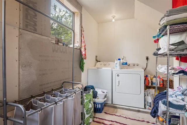 a view of a livingroom with furniture and a window