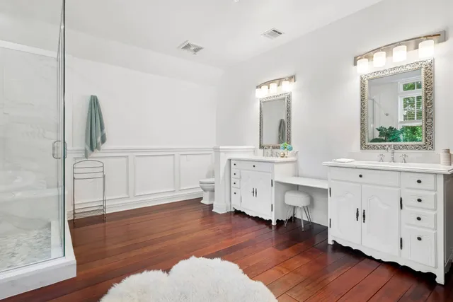 a bathroom with a sink mirror and window