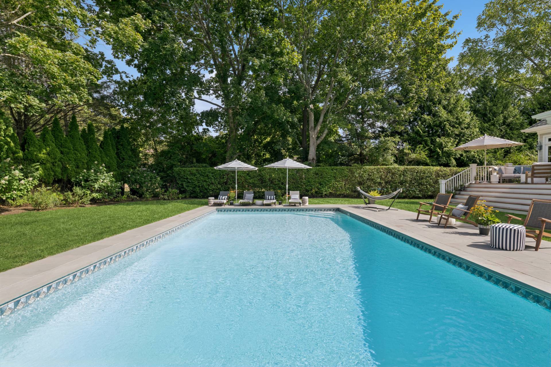Undisclosed Address Remsenburg, NY 11960 - Photo 2 of 35 a view of swimming pool with outdoor seating and garden