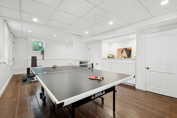 a room with stainless steel appliances lots of counter space and wooden floor