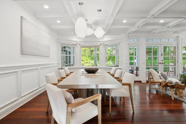 a view of a dining room with furniture window and outside view