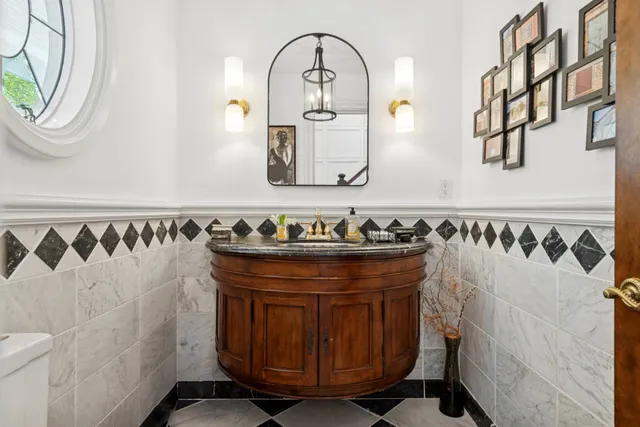 a aerial view of a house with a yard and large tree