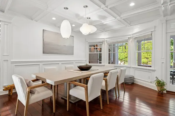 a view of a dining room with furniture window and wooden floor