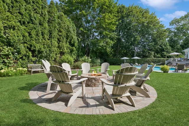a view of yard with outdoor seating and green space