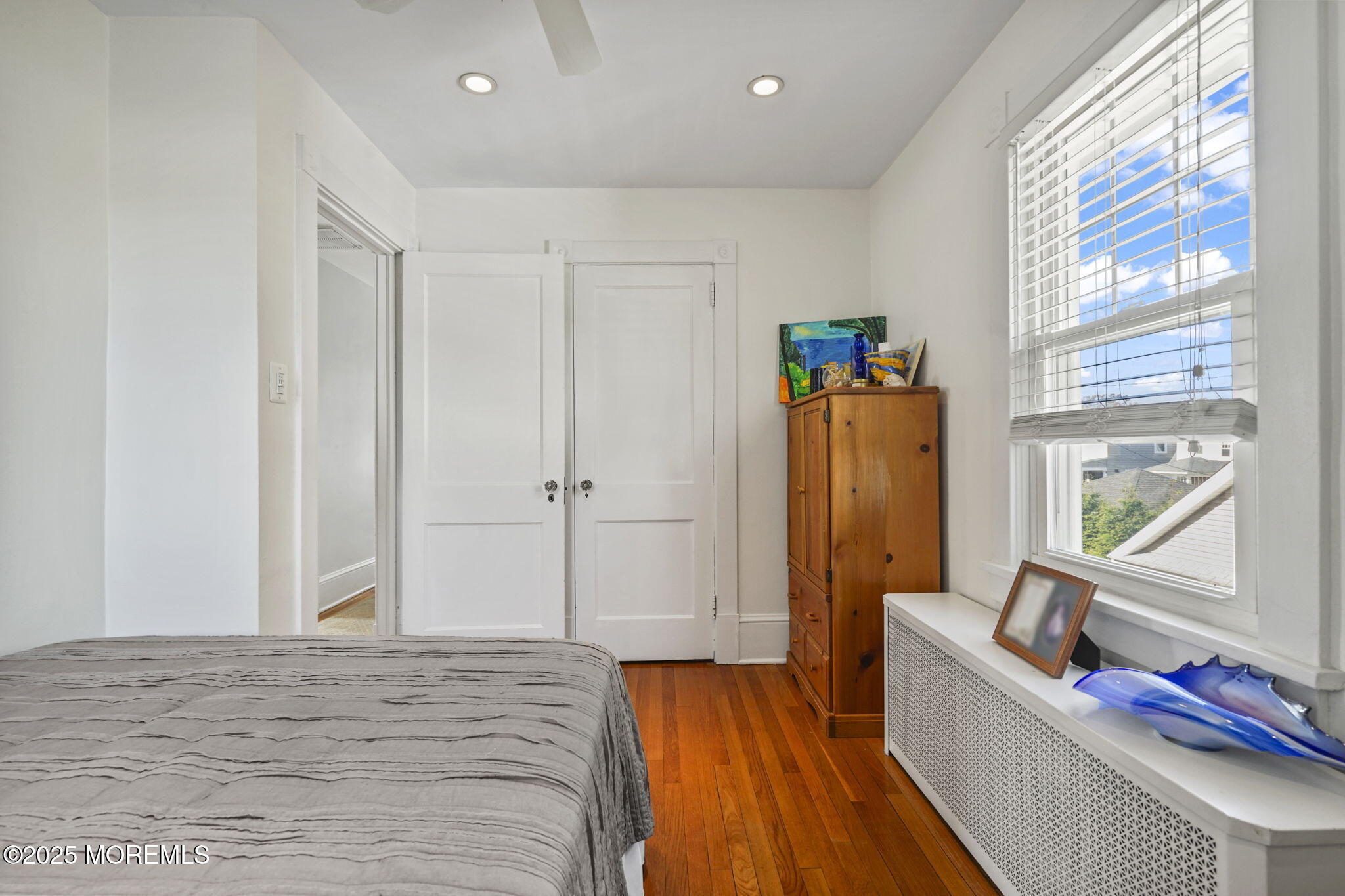 22 Albany Road Neptune Township, NJ 07753 - Photo 14 of 40 a view of a bedroom with wooden floor and windows
