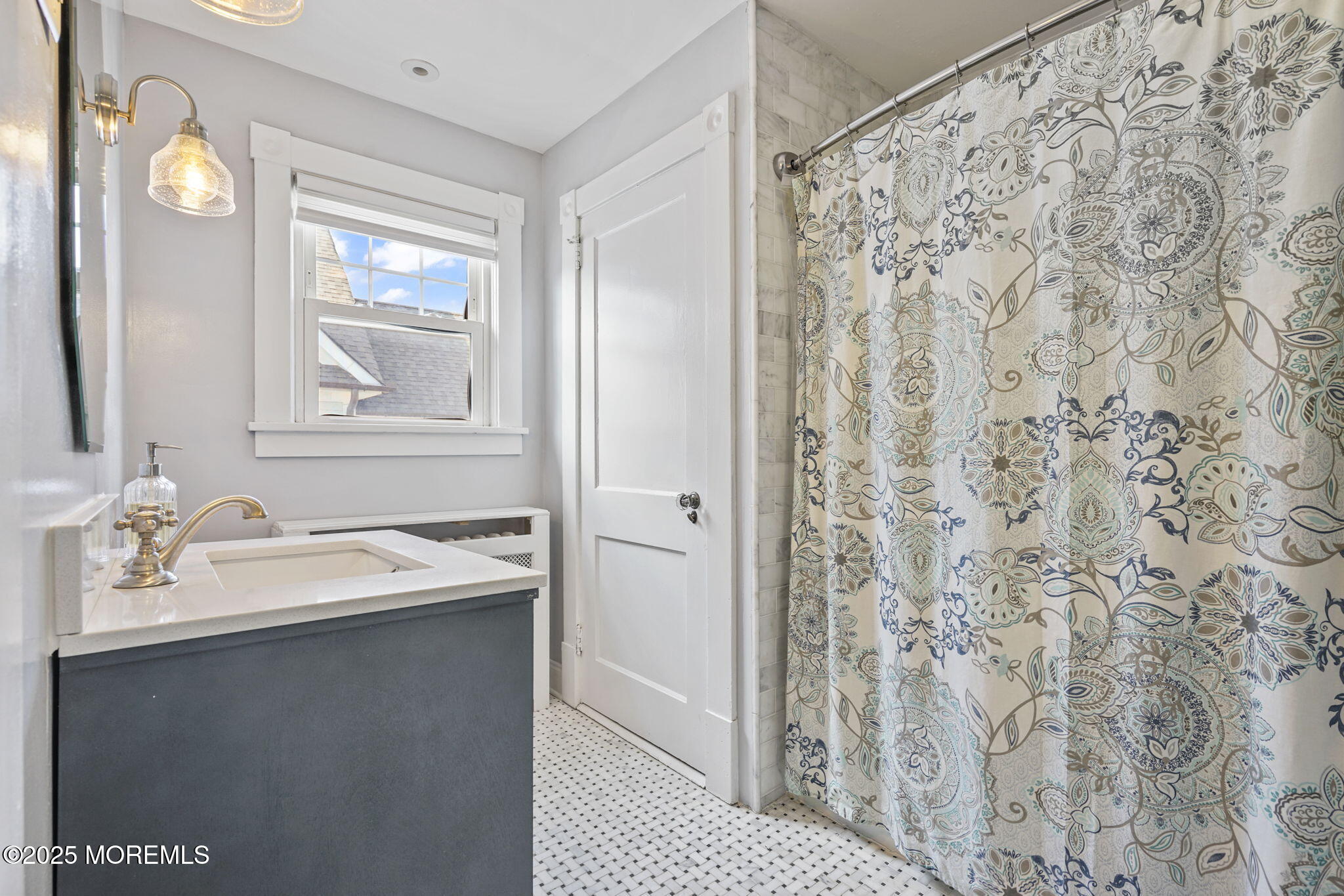 22 Albany Road Neptune Township, NJ 07753 - Photo 20 of 40 a bathroom with a sink and a mirror