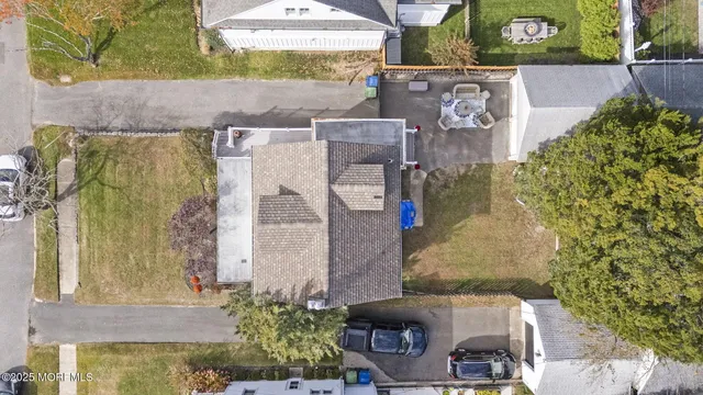 an aerial view of a house with outdoor space