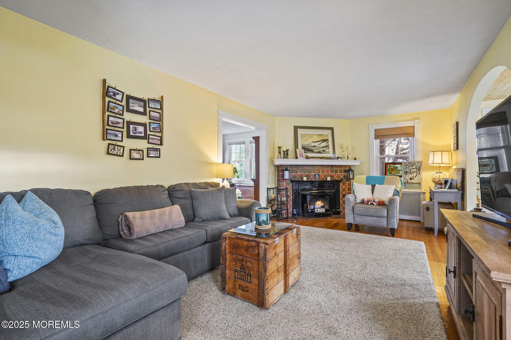 22 Albany Road Neptune Township, NJ 07753 - Photo 8 of 40 a living room with furniture large window and a fireplace