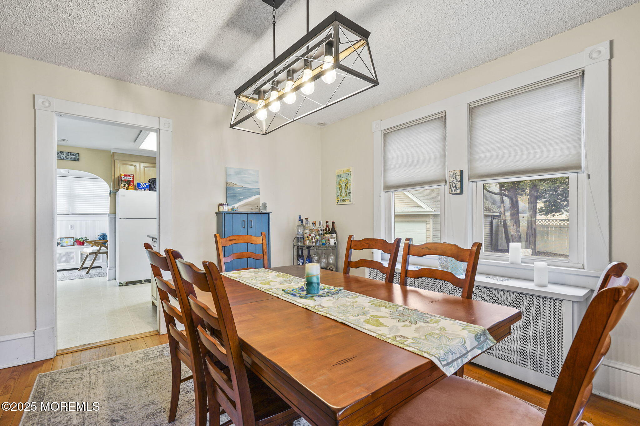 22 Albany Road Neptune Township, NJ 07753 - Photo 9 of 40 a dining room with furniture a chandelier and wooden floor
