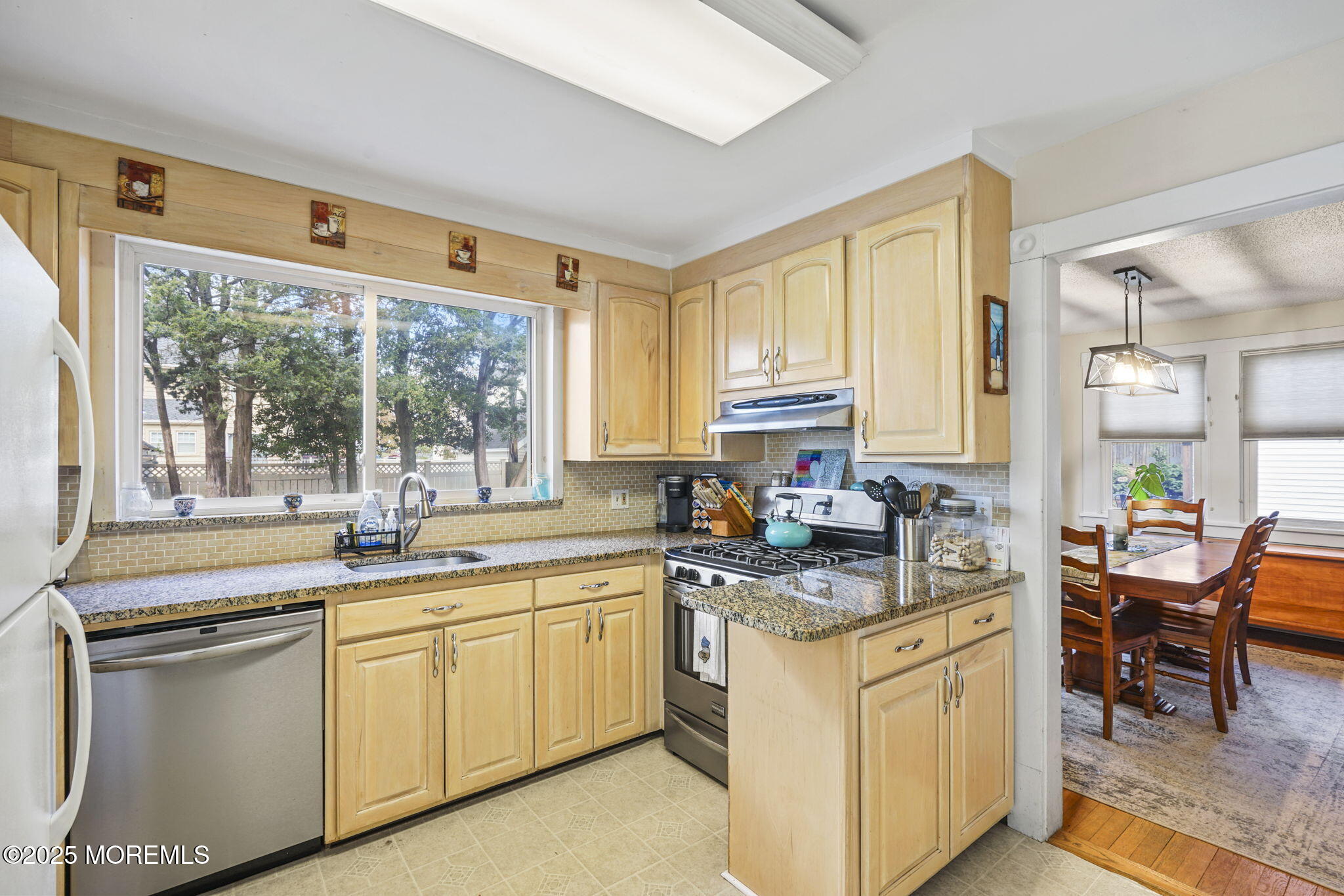 22 Albany Road Neptune Township, NJ 07753 - Photo 10 of 40 a kitchen with white cabinets and white appliances