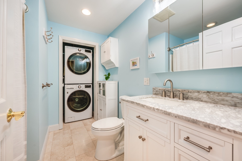 39 Chestnut Street, Unit 2C Stoneham, MA 02180 - Photo 14 of 21 a utility room with sink dryer and washer