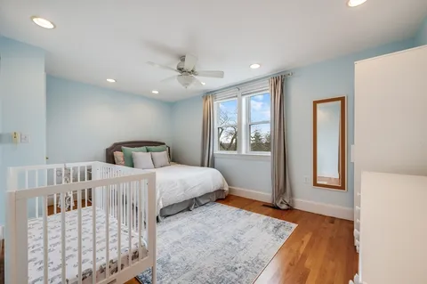 a bedroom with furniture and window