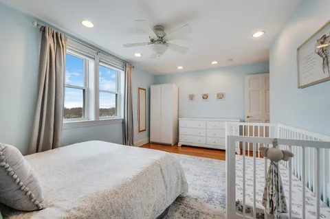 a bedroom with furniture and a window