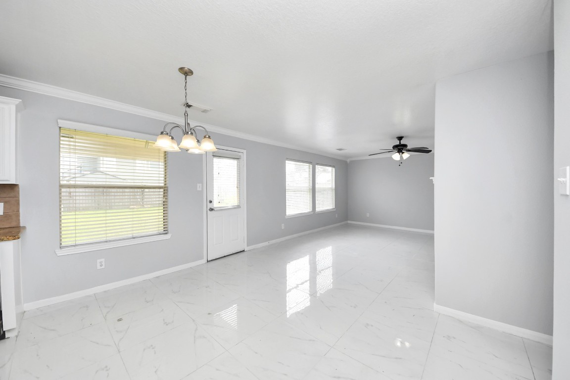 2406 Gwenfair Drive Spring, TX 77373 - Photo 12 of 44 a view of a room with windows and chandelier
