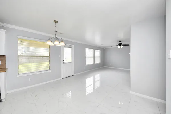 a kitchen with granite countertop a stove and a sink