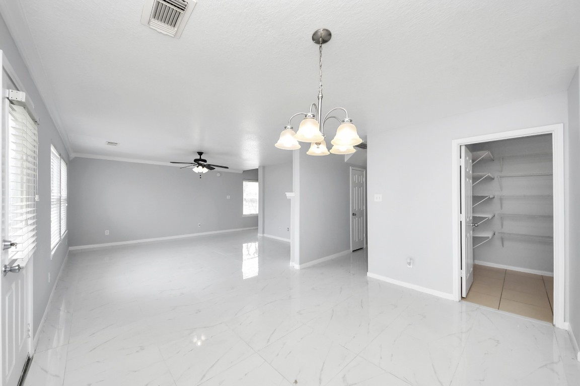 2406 Gwenfair Drive Spring, TX 77373 - Photo 13 of 44 a view of a chandelier in big room and chandelier fan