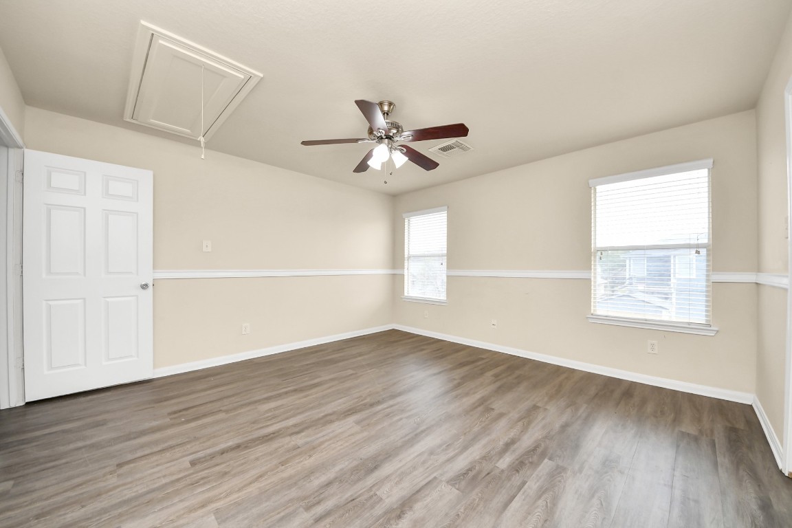 2406 Gwenfair Drive Spring, TX 77373 - Photo 29 of 44 wooden floor in an empty room with a window
