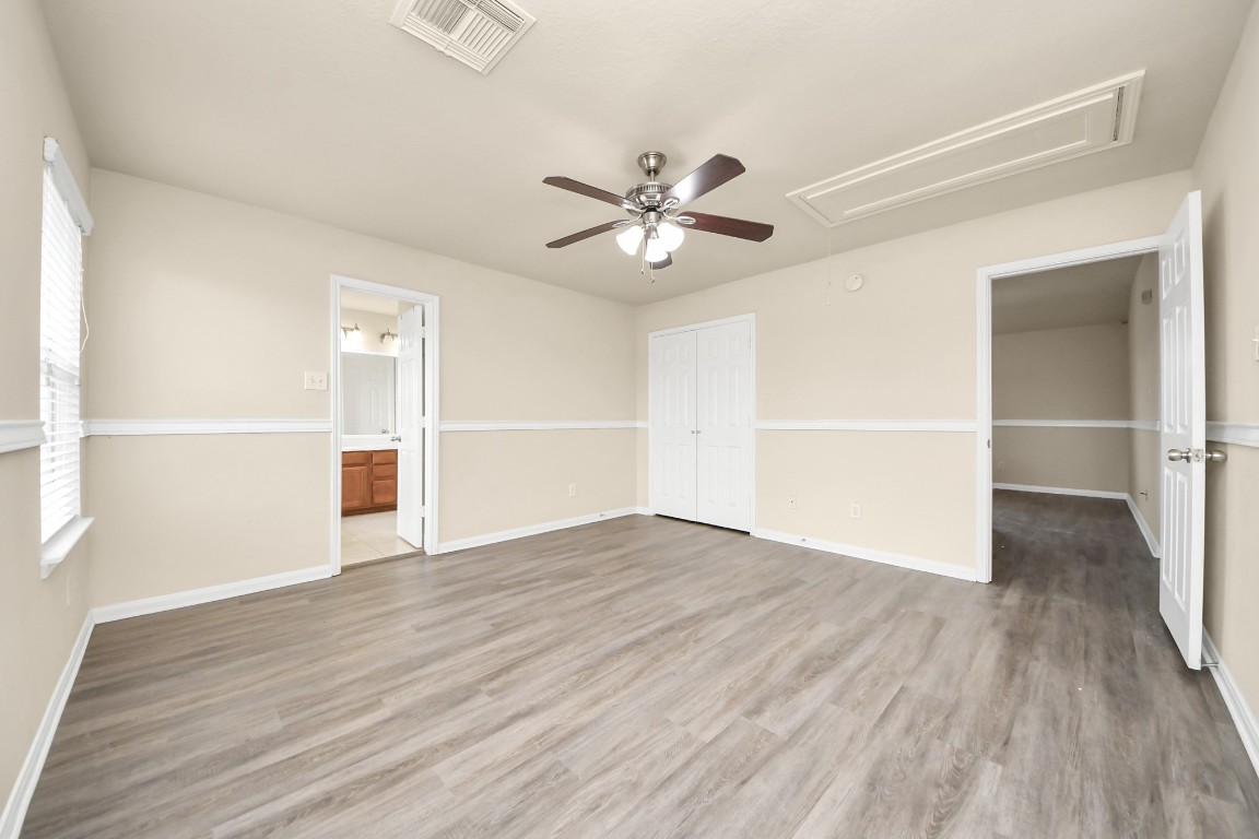 2406 Gwenfair Drive Spring, TX 77373 - Photo 30 of 44 wooden floor in an empty room with a window