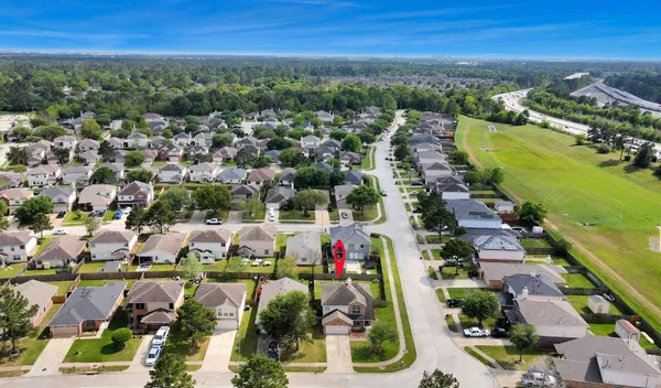 an aerial view of residential houses with outdoor space