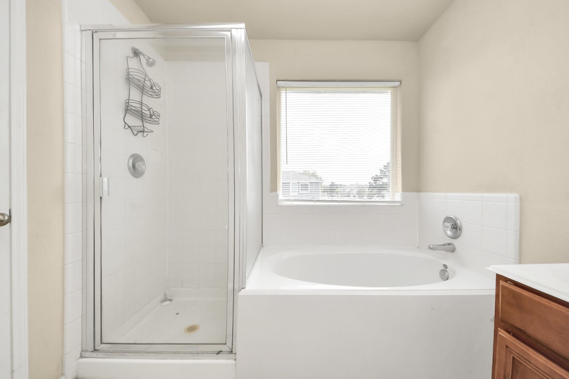 2406 Gwenfair Drive Spring, TX 77373 - Photo 34 of 44 a white bath tub sitting next to a shower