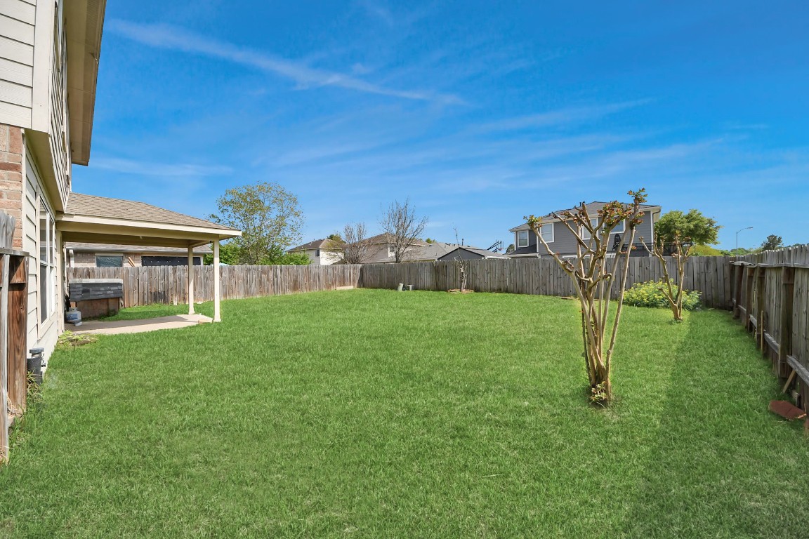 2406 Gwenfair Drive Spring, TX 77373 - Photo 38 of 44 a view of a house with backyard and a garden