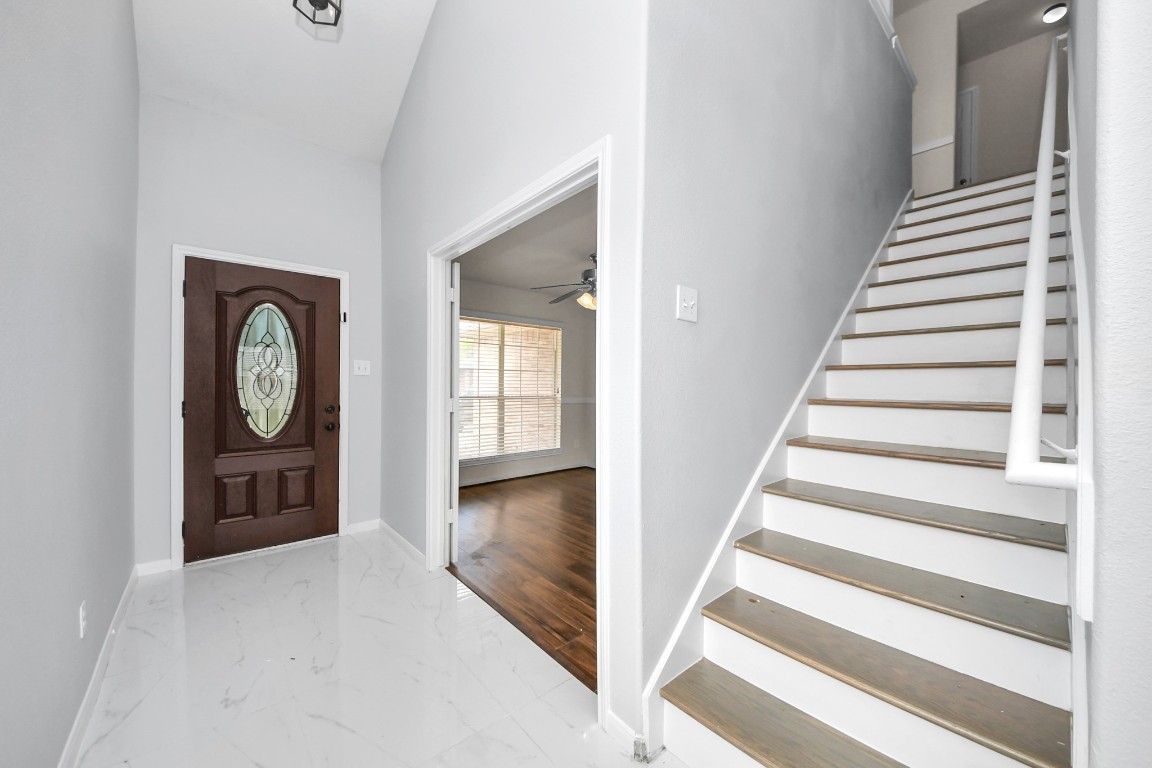 2406 Gwenfair Drive Spring, TX 77373 - Photo 5 of 44 a view of an entryway with wooden floor