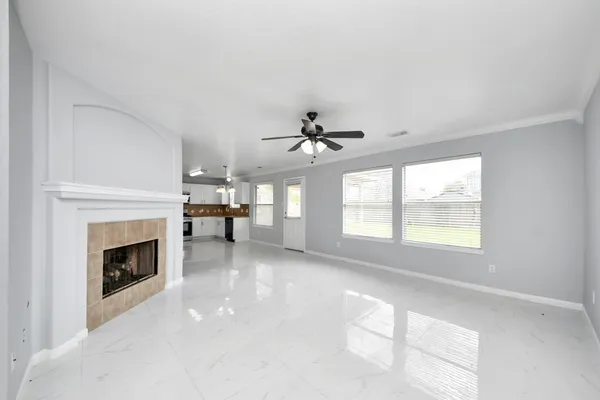 a view of a room with windows and chandelier