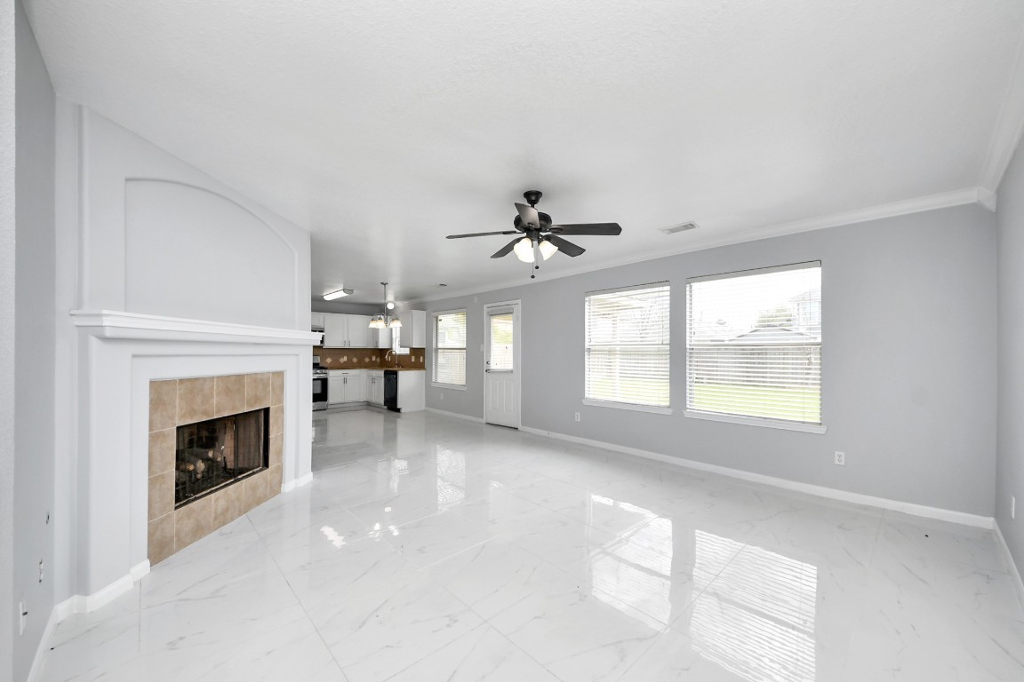 2406 Gwenfair Drive Spring, TX 77373 - Photo 7 of 44 a living room with furniture and a fireplace