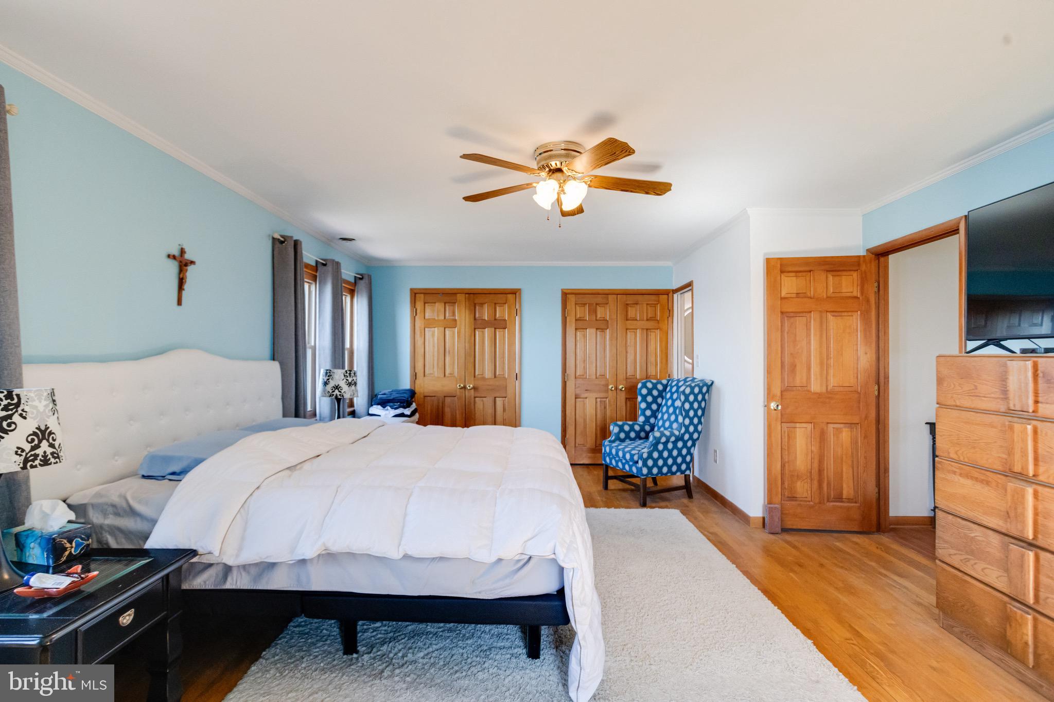1452 Galena Road Baltimore, MD 21221 - Photo 35 of 80 a bedroom with a bed and a chandelier