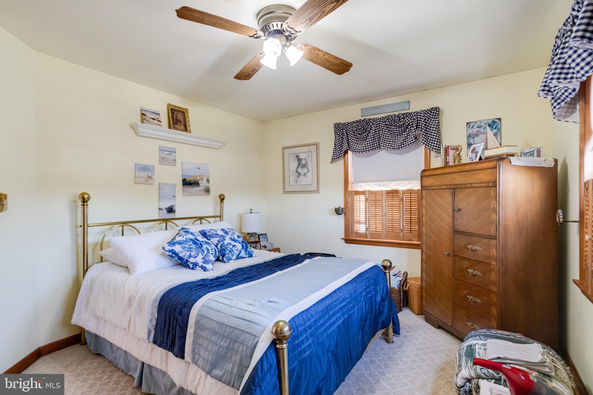 1452 Galena Road Baltimore, MD 21221 - Photo 44 of 80 a bedroom with a bed and a chandelier