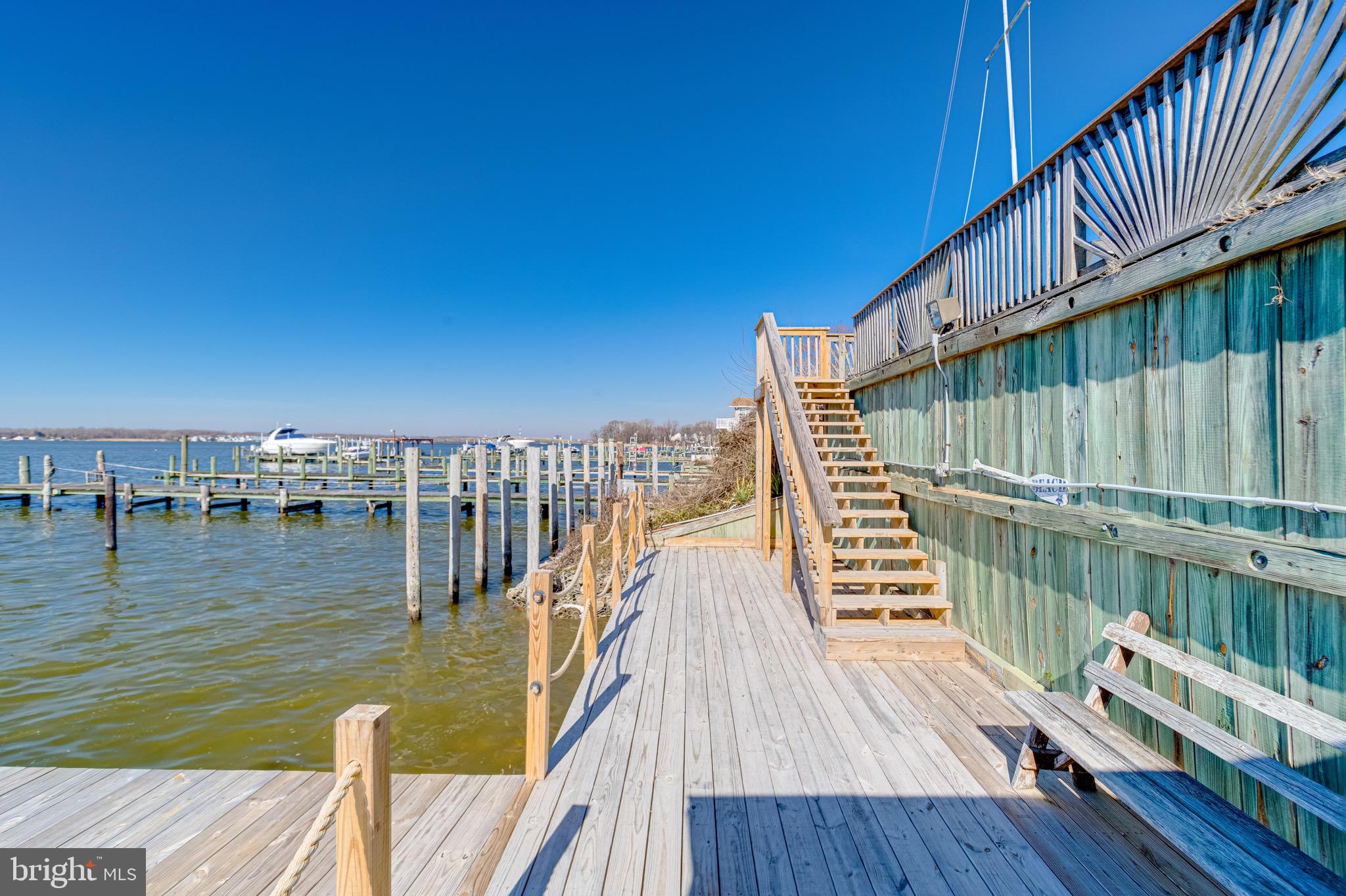 1452 Galena Road Baltimore, MD 21221 - Photo 60 of 80 a view of a balcony with wooden floor and lake view